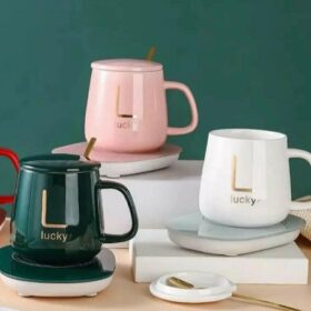 Coffee cup with heating pad and spoon